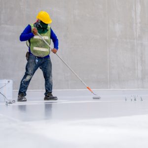 Man applying concrete coating